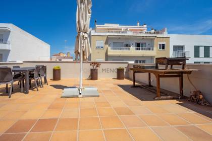 Renovated house for sale with garage and two terraces.