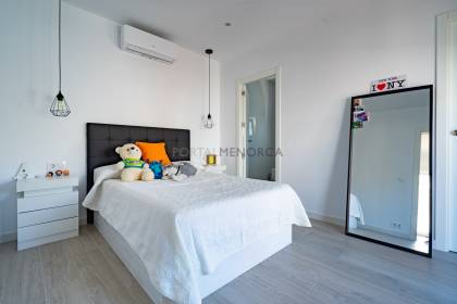 Renovated house for sale with garage and two terraces.