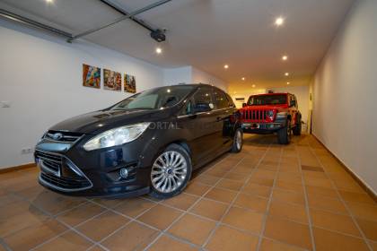 Renovated house for sale with garage and two terraces.