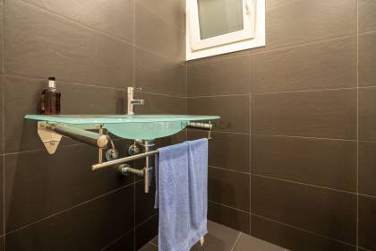 Renovated house for sale with garage and two terraces.