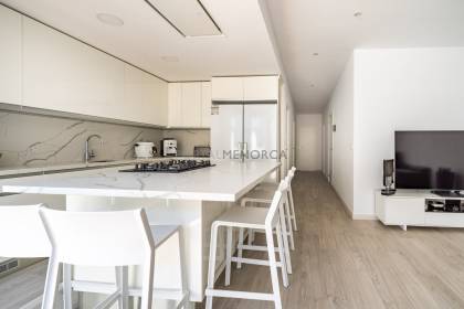 Renovated house for sale with garage and two terraces.