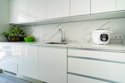 Renovated house for sale with garage and two terraces.