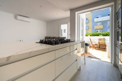 Renovated house for sale with garage and two terraces.