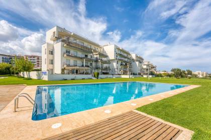 Front line, first-floor apartment with shared pool by Mahon Port